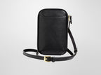 Black leather crossbody bag on a light gray background