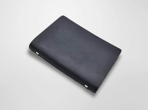 Black leather wallet on a light gray background