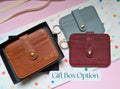 Three leather card holders in brown, gray, and red on a colorful polka dot background with 'Gift Box Option' text. Featuring personalisation.