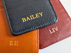 Close-up of a leather product with custom embossed on it, on a white background.